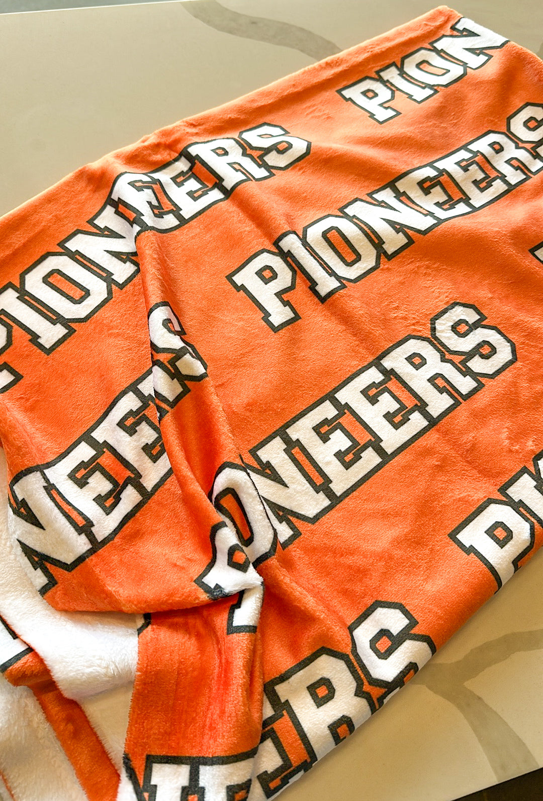 Orange Pioneers Varsity Throw Blanket