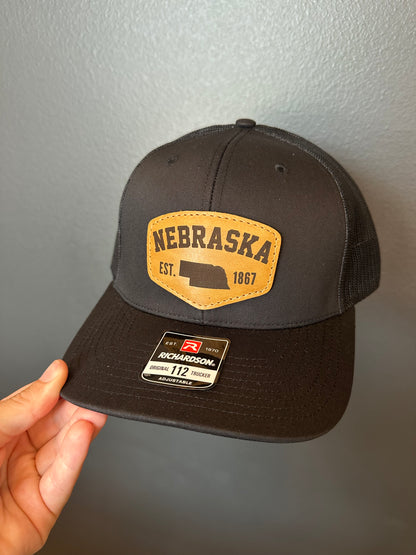 Nebraska Est. 1867 Leather Patch Trucker Hat