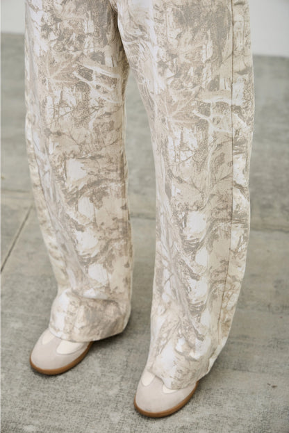 Mid Rise Camo Barrel Leg Jeans