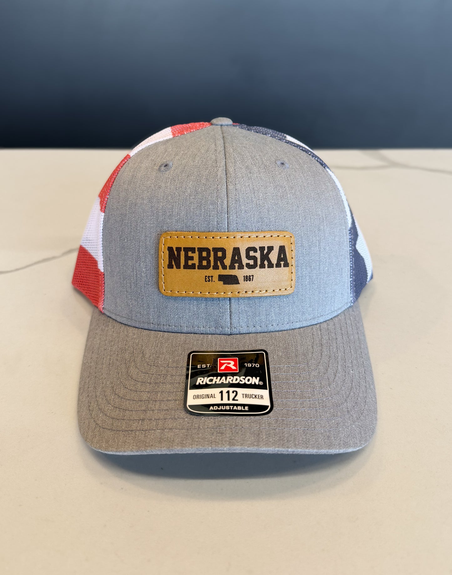 Nebraska American Flag Leather Patch Trucker Hat