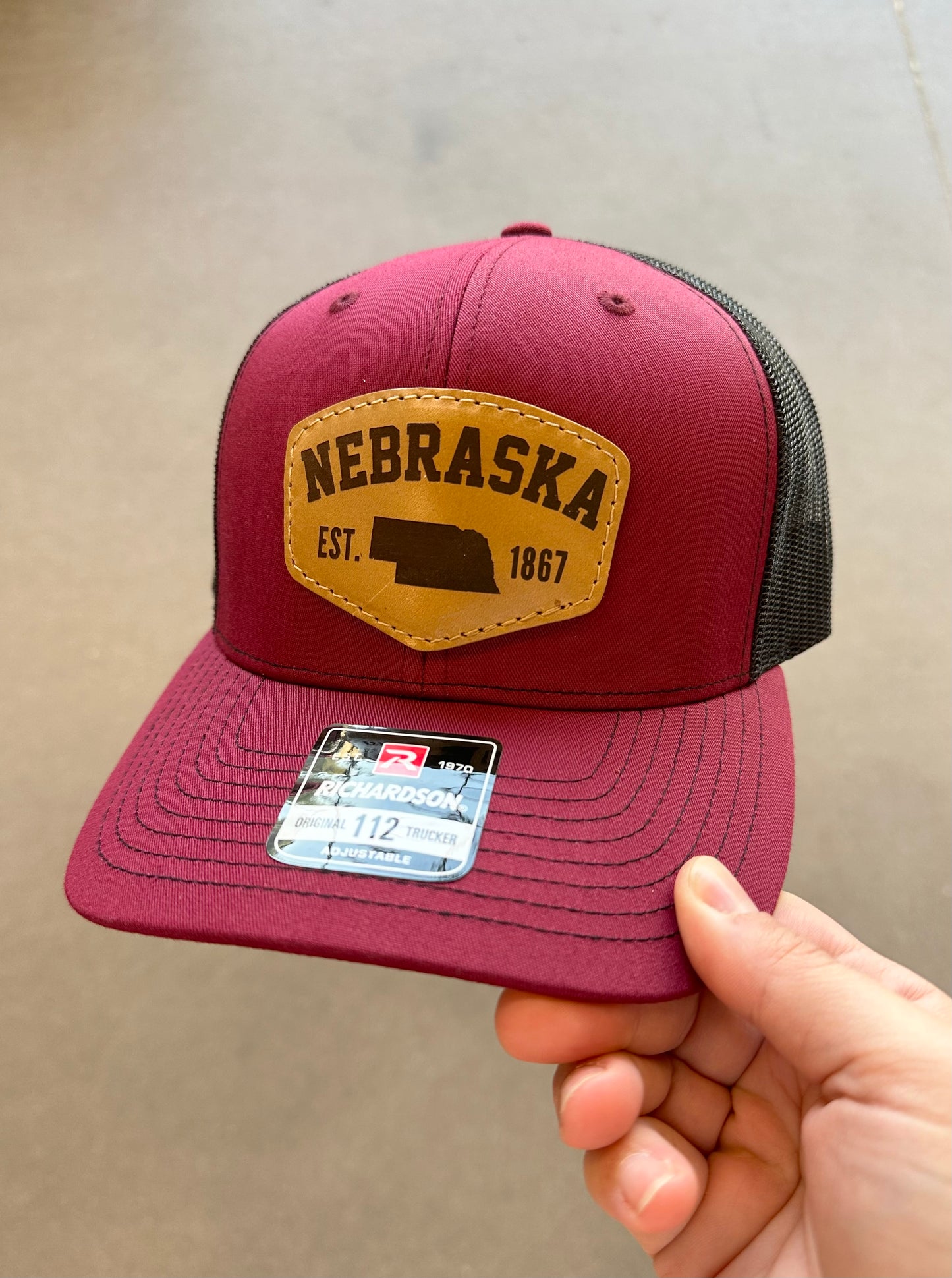 Nebraska Est. 1867 Leather Patch Trucker Hat