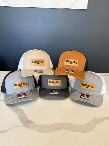 Nebraska Leather Patch Trucker Hat